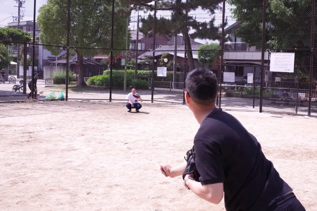 Joyful moment of friends playing catch ball at Akasaka Park in Nagoya,