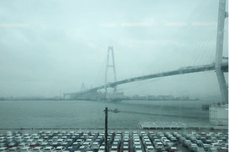 Reflecting its status as an industrial city, Nagoya's port features rows of cars ready for export.