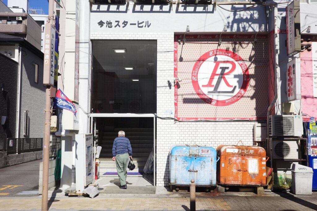 Man entering Nagoya Cinematheque in Imaike