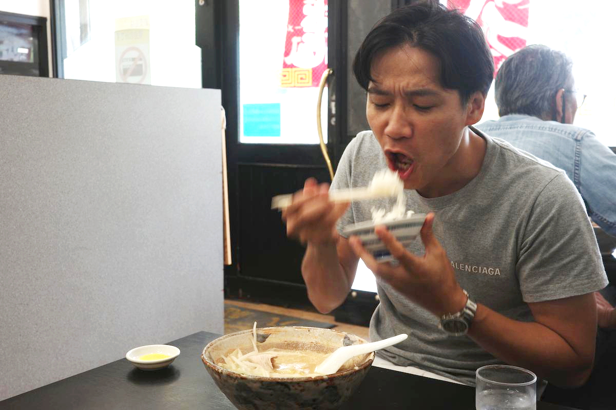 Eating Miso ramen and rice at Hachiryu.