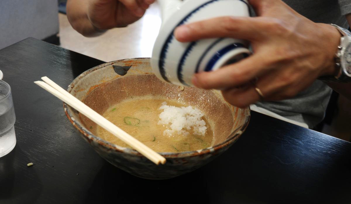 Turning the remaining portion into rice porridge.