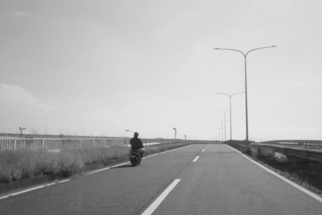 Heading towards Kinjo Pier by motorcycle.