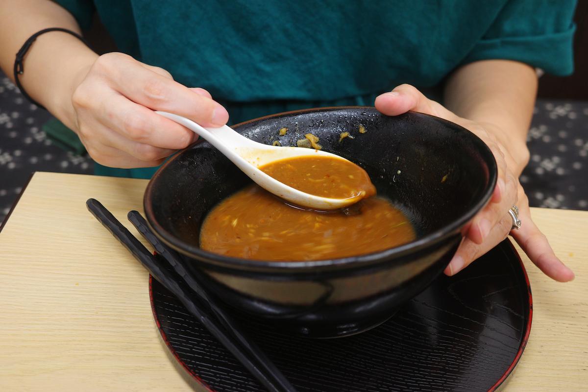 Women devour the miso soup, leaving no trace behind.