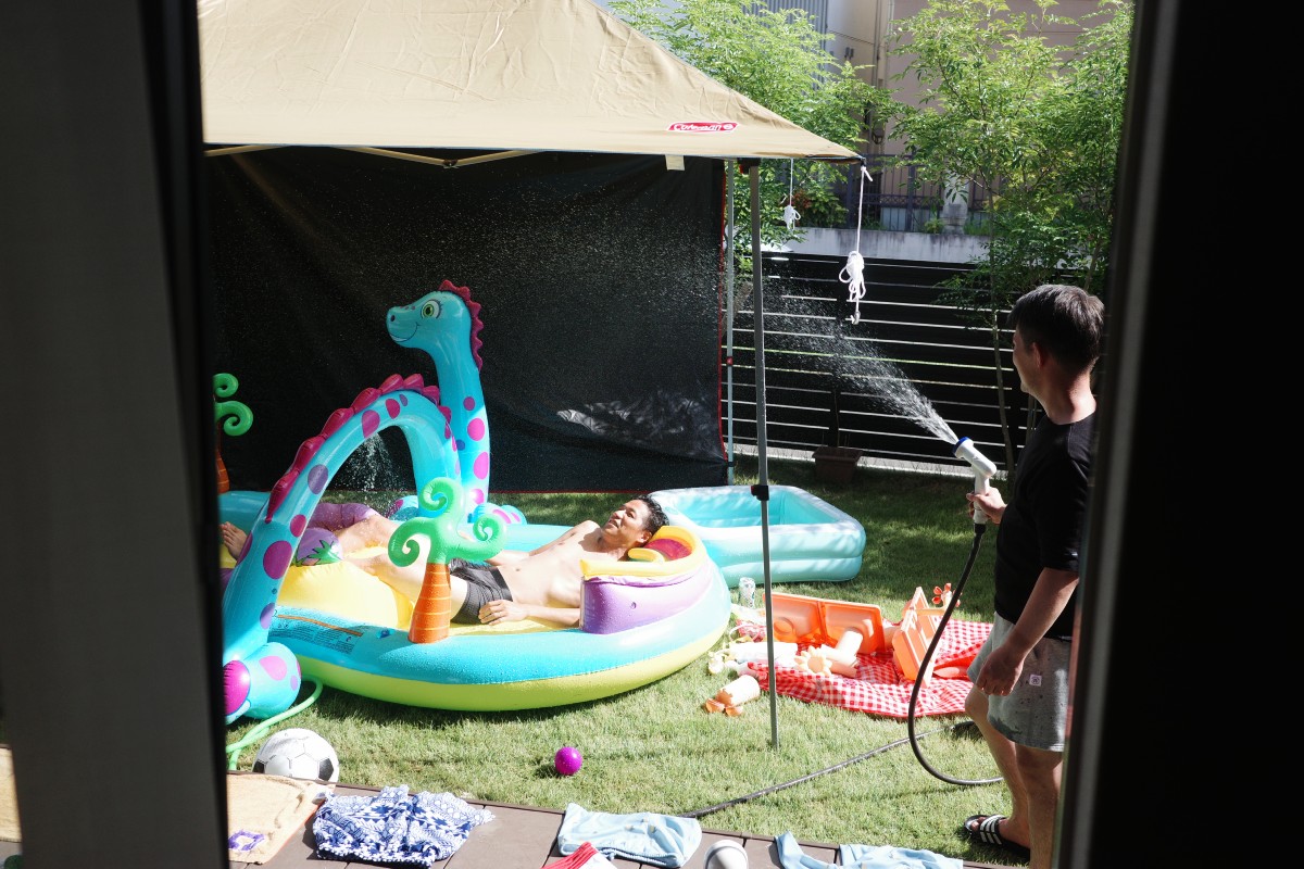 adults embracing inflatable pool