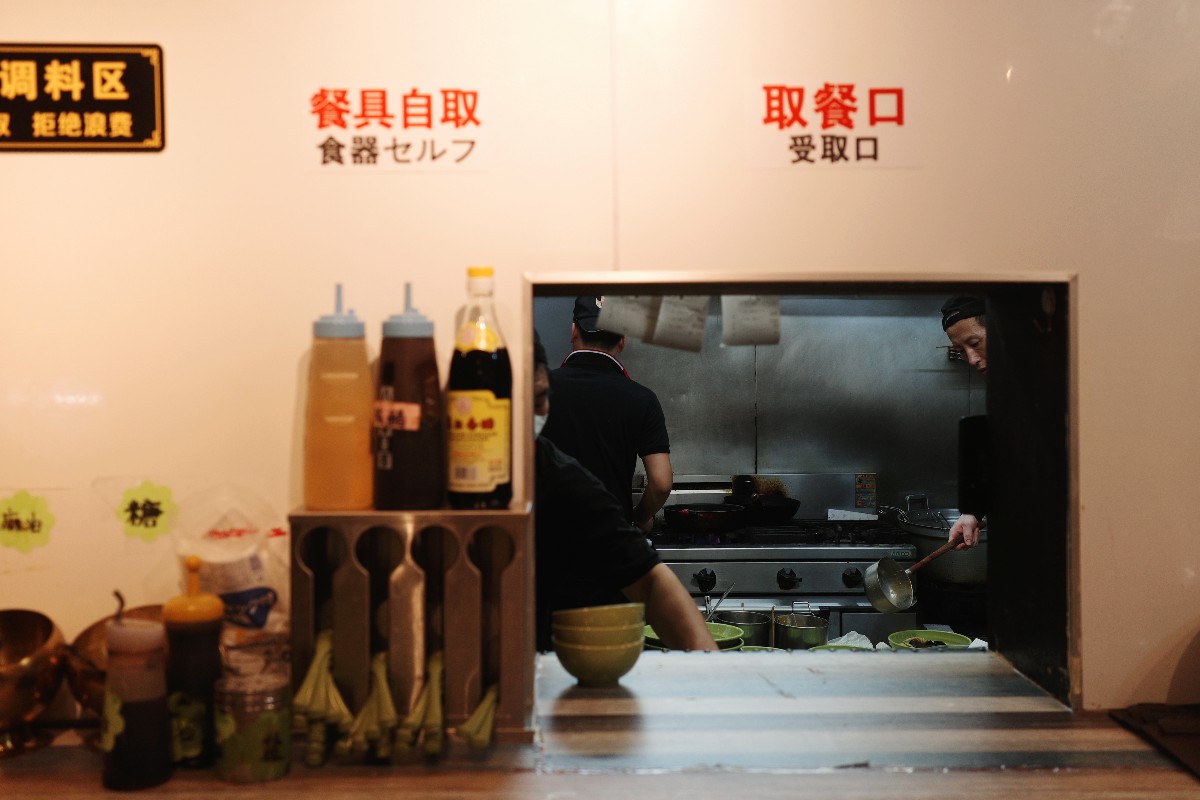 Chinese staff cooking in authentic style. 