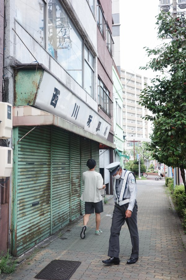 An aged toy store with closed shutters.