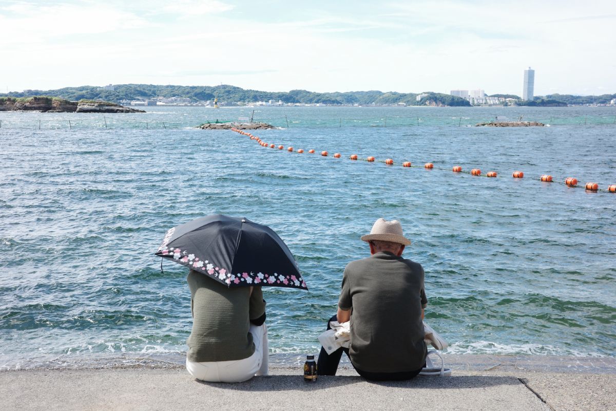 Elderly Couple Relaxing at Himakajima Port.