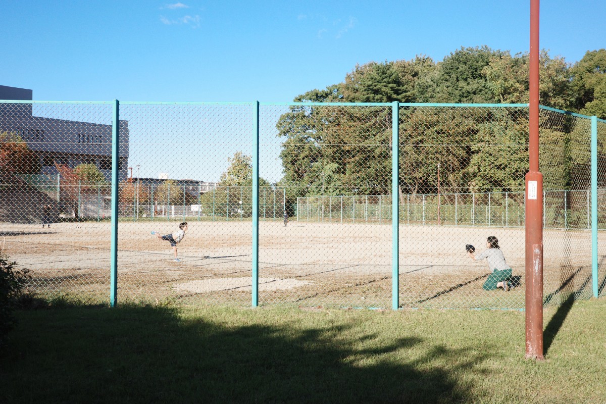 Kid and Mother Bonding Through Baseball Play at Kanoko Park in Nagoya.