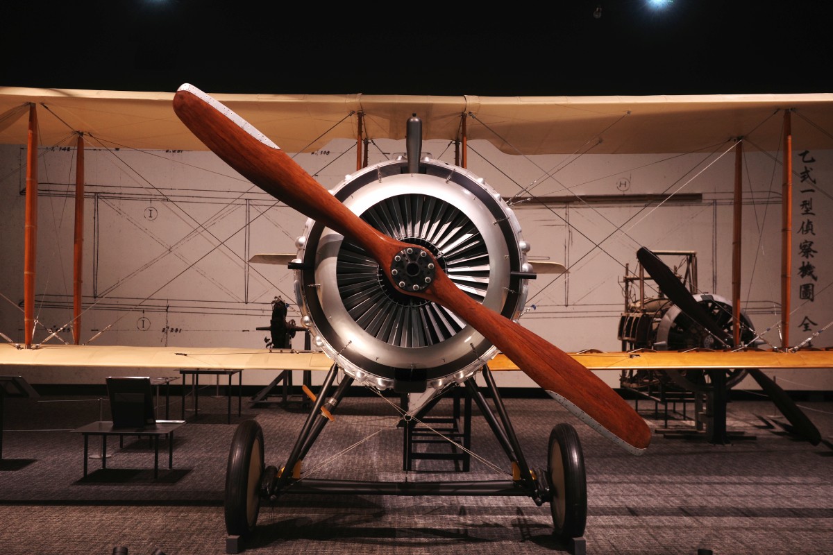 Vintage aircraft displayed in a history exhibition at Kakamigahara Aerospace Science Museum, showcasing the rich aviation heritage.