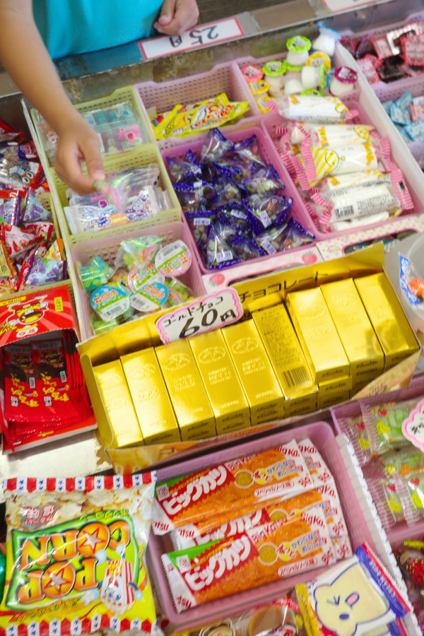 A variety of colorful candies on display at Kantenya, highlighting Nagoya's local food and culture in a nostalgic dagashi-ya setting.