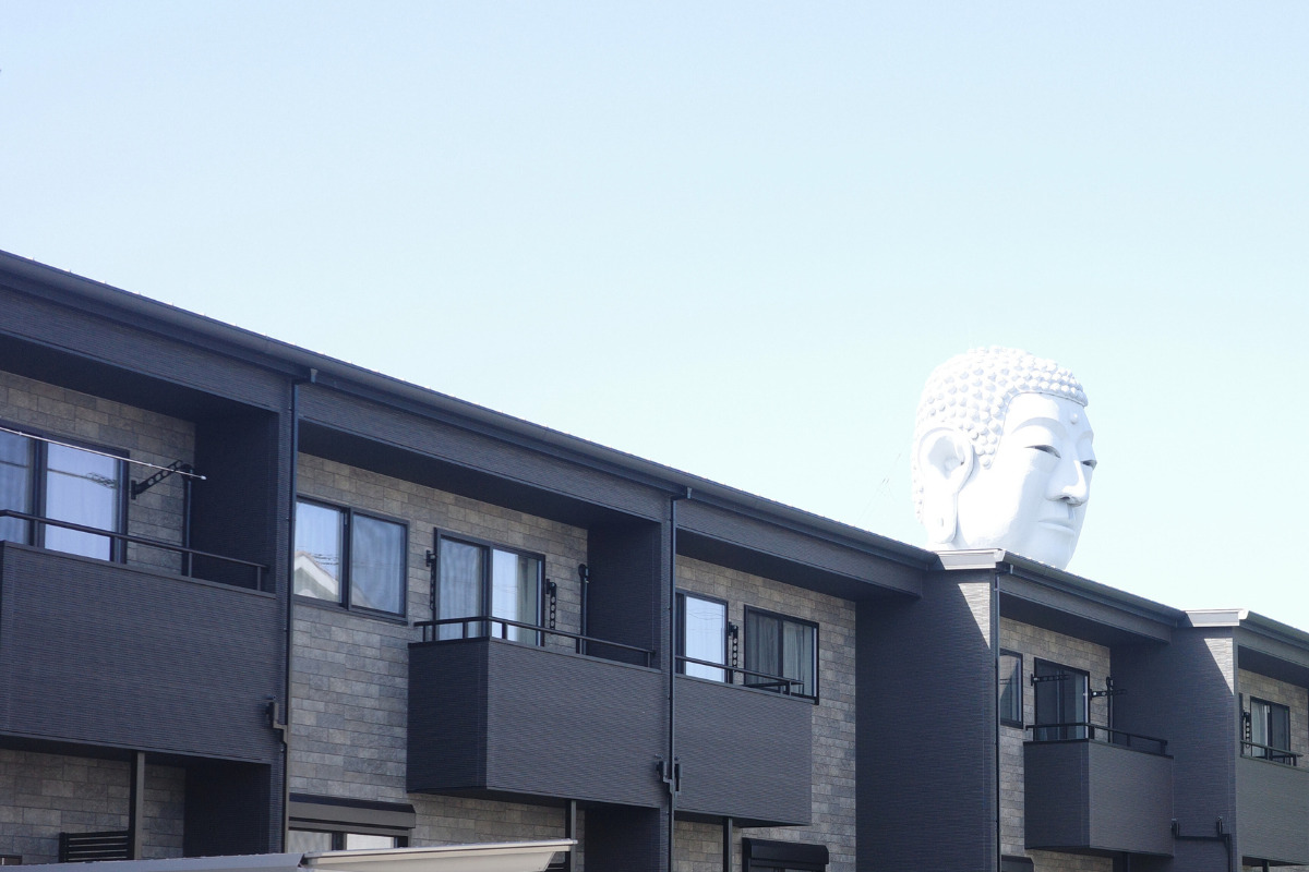 The Great Buddha at Hotei, towering majestically in a residential neighborhood.