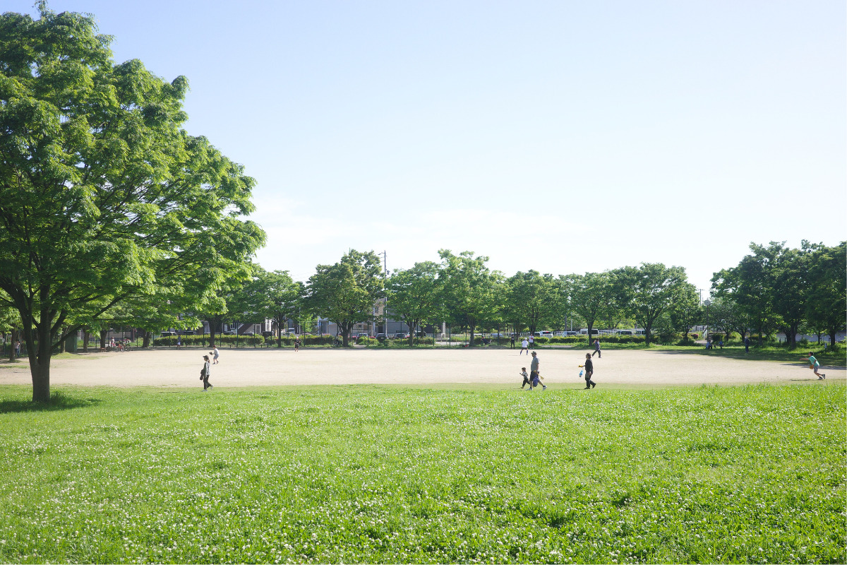 Families enjoying the open fields and play areas at Tomita Park, a local hidden gem in Nagoya.