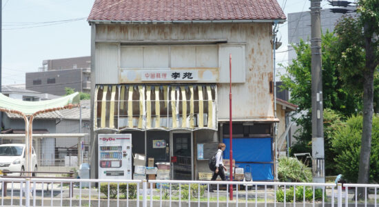 The unassuming exterior of Rien, a hidden gem in Nagoya. Despite its worn-out awning and rustic look, this Chinese restaurant offers incredible flavors inside.