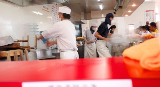 Chefs working in the open kitchen of Ramen Fuku, a hidden gem of ramen in Nagoya, where the culinary action is on full display.