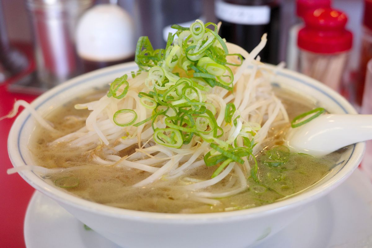 A classic ramen bowl from Ramen Fuku, featuring bean sprouts and green onions, the hidden gem of ramen in Nagoya.